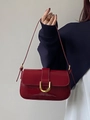 Chic burgundy shoulder bag with gold horse-shoe buckle and glossy patent finish - Red