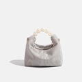 Silver metallic pleated dumpling bag featuring a large pearl handle and metal zipper - Grey