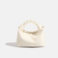 Creamy white mini crossbody dumpling bag with elegant oversized pearl handle and gold zipper - White