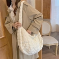 Quilted off-white puffy hobo bag with cloud-like texture and soft padded shoulder strap - White