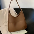 Brown soft faux leather hobo tote bag with a practical front pocket for daily commute - Brown
