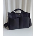 Sac à langer noir polyvalent avec plusieurs poches, détails dorés et bandoulière - Noir