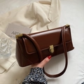 Deep brown vintage leather baguette bag with gold metal buckle and sleek shoulder strap - Brown
