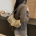 Gold metallic crescent shoulder bag with buckles and studs, stylish moto commuter handbag. - Gold