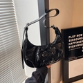 Detail of black patent leather crescent bag with cross-lace ballet style ribbons - Black