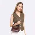 Elegant reddish-brown leather handbag with a minimalist curved design for women's fashion - Coffee