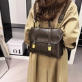 Vintage dark brown leather backpack with golden buckles and stylish contrast stitching - Coffee