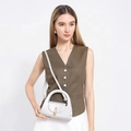 Silver semicircular handbag with metallic finish and gold buckle shown on a model - Silver
