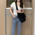 Grote zwarte kunstleren hobo-tas gedragen met een casual outfit voor een chique look - Zwart