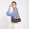Dark brown faux leather shoulder bag with drawstring detail shown on a female model - Coffee