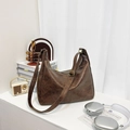 Retro deep brown large leather tote bag with adjustable strap in a minimalist setting - Coffee