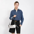 Metallic silver shoulder bag with adjustable strap shown on a professional model - Silver