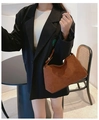 Close-up of brown matte suede shoulder bag featuring a vintage minimalist trapezoid design - Brown
