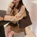 Minimalist dark coffee tote bag with wide strap worn by a model in an urban cafe setting - Coffee