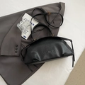 Minimalist black leather bowling bag with vintage gold hardware and dual handles - Black