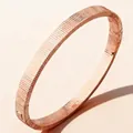 Rose gold stainless steel bracelet with vertical textured stripes and geometric industrial finish - Rose Gold Dense Grooved Nail (47-C-6)