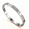 Close-up of polished silver steel bracelet with sparkling diamond-set geometric patterns - Steel Color Geometric Paved Zirconia (52-C-3)