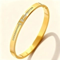 Macro detail of gold-plated stainless steel bracelet with double T-motif crystal inlay - Gold Double T Zirconia (52-C-2)
