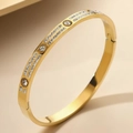 Polished golden stainless steel bangle featuring round rhinestones and a hinge closure - Gold Full Zircon Style