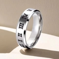 Macro shot of silver stainless steel ring with engraved Roman numerals and polished finish - US 7 / Silver (Beveled Roman Numerals)