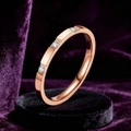Minimalist rose gold stainless steel ring with three inlaid diamonds on velvet display - US 5 / 3 Zirconia Rose Gold