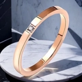 Minimalist rose gold stainless steel ring featuring a square-set round zircon stone - US 5 / Single Stone Style / Rose Gold