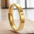 Polished 18K gold titanium steel ring with a single small inset crystal on a wooden base - US 7 / Single Stone Style (4mm) / Gold