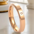 Elegant rose gold stainless steel ring featuring a thin band and a single round diamond - US 7 / Single Stone Style (4mm) / Rose Gold