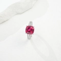 Macro detail of cushion-cut ruby ring on white rock, showcasing silver pavé setting - HK15# / Lab-Grown Ruby
