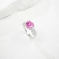 Close-up of heart-cut pink sapphire ring with tapered baguette accents on rock texture - HK Size 15# / Lab-Grown Pink Sapphire