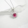 Macro detail of S925 silver necklace with square rose-red gem and zircon cluster - Lab-Grown Ruby