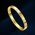 Bracciale a quadrifoglio dorato in acciaio inossidabile con strass e finitura lucida - Oro
