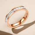 Macro detail of rose gold eternity ring featuring square-cut sparkling cubic zirconia - US 5 / Single Row Square Diamond Rose Gold