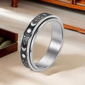 Silver stainless steel spinner ring with black celestial sun moon and star motifs - Spinner Moon Star Black Decor (1-C-4)