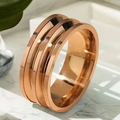 Rose gold multi-layer spiral stainless steel ring with polished finish on marble surface - Size 7 / Rose Gold