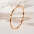 Minimalist rose gold titanium steel ring with polished finish in soft natural lighting - US 5 / 1mm Width / Rose Gold