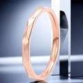 Macro shot of rose gold faceted ring showing irregular geometric light reflections - US 10 / 2.5mm / Rose Gold