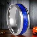 Silver stainless steel ring with deep blue marble resin inlay on a dark wood background - US 10 / Steel