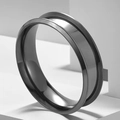 Polished black titanium steel ring with unique outer groove on white display block - US 6 / Black