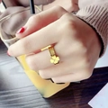 Three-band golden clover ring in polished finish worn on finger for a stylish look - US 5 / Gold