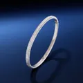 Luxe silver stainless steel bangle fully paved with sparkling cubic zirconia crystals - Silver