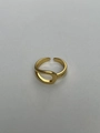 Detail view of the hollow curved surface and gold finish of the knot open ring - Gold