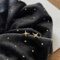 Elegant 925 sterling silver gold star stud earrings on a dark textured background - Gold