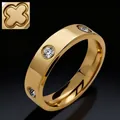 Macro shot of gold clover ring with clear zircons and polished finish on black background - Size 7 / Four-Leaf Clover Style / Gold