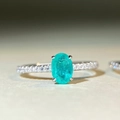 Macro shot of oval blue zircon S925 silver ring with four-prong set gemstone and side stones - Paraiba With Inclusion-CBJZ514