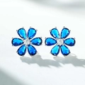Detail of S925 silver flower stud earrings with blue pear-cut petals and center stone - Deep Blue (ED028)