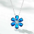 Macro detail of a 925 silver flower pendant featuring blue pear-cut petals and white zircon - 925 Silver / Deep Blue Flower Pendant Necklace