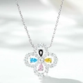 Close-up of four-leaf clover pendant with multi-colored gems and sparkling diamonds - 925 Silver / Multicolor Rhinestone