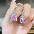 Macro shot of S925 silver earrings with radiant cut pink stones and pavé diamonds - 925 Silver / Pink