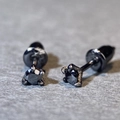 Detail macro view of black dragon claw stud earrings with dark faceted gemstone - 0.1ct Moissanite / Dark Black (Black Metal)